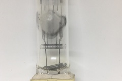 Lamp with expansion on envelope, potentially due to grease from fingers causing uneven expansion of the envelope