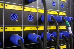 Numbered Powercon inlets (coloured blue) in the dimmer room connect to each outlet on the lighting rig.