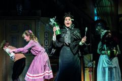 Mary Poppins London Company 2023 - Logan Clark as Michael Banks, Ellie Kit Jones as Jane Banks, Liz Robertson as Miss Andrew and Claire Machin as Mrs Brill. Photo by Johan Persson