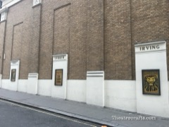 Stonework honouring Ellen Terry, Bram Stoker and Henry Irving, on the flytower constructed as part of the 1996 refurbishments (photo 2017)
