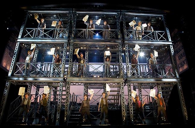 Newsies, the Musical 601 Disney's Newsies, directed by Jeff Calhoun at Papermill Playhouse 9/15-10/16/11 Music by Alan Menken Lyrics by Jack Feldman Book by Harvey Fierstein Based on the Disney Film written by Bob Tzudiker and Noni White Choreography by Christopher Gattelli Lighting Design:Jeff Coiter Costume Design: Jess Goldstein Set Design: Tobin Obst Photograph © T Charles Erickson http://tcharleserickson.photoshelter.com/